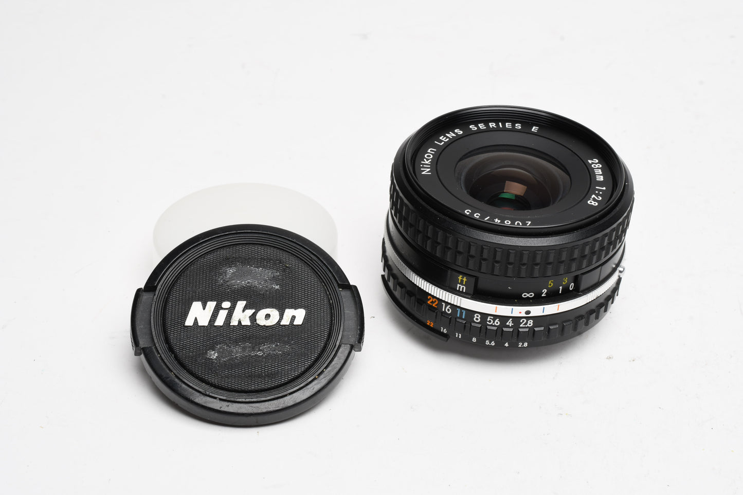 Nikon Series E 28mm f2.8 Wide angle lens, caps, good *Read