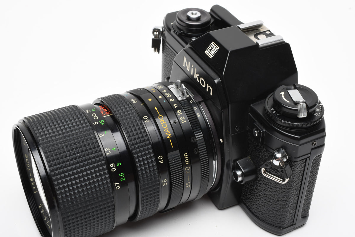 Nikon EM 35mm SLR w/Access 35-70mm zoom, Strap, New Seals, Great!