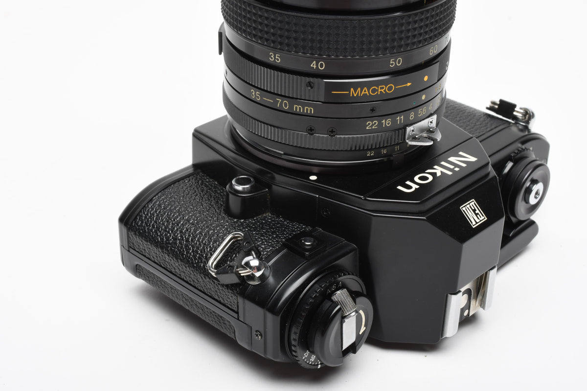 Nikon EM 35mm SLR w/Access 35-70mm zoom, Strap, New Seals, Great!