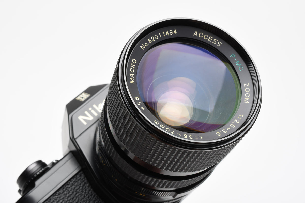Nikon EM 35mm SLR w/Access 35-70mm zoom, Strap, New Seals, Great!