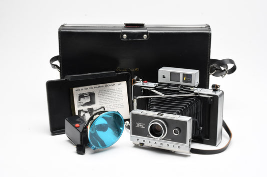 Polaroid Land 250 Instant camera w/fitted case and flash reflector, Clean
