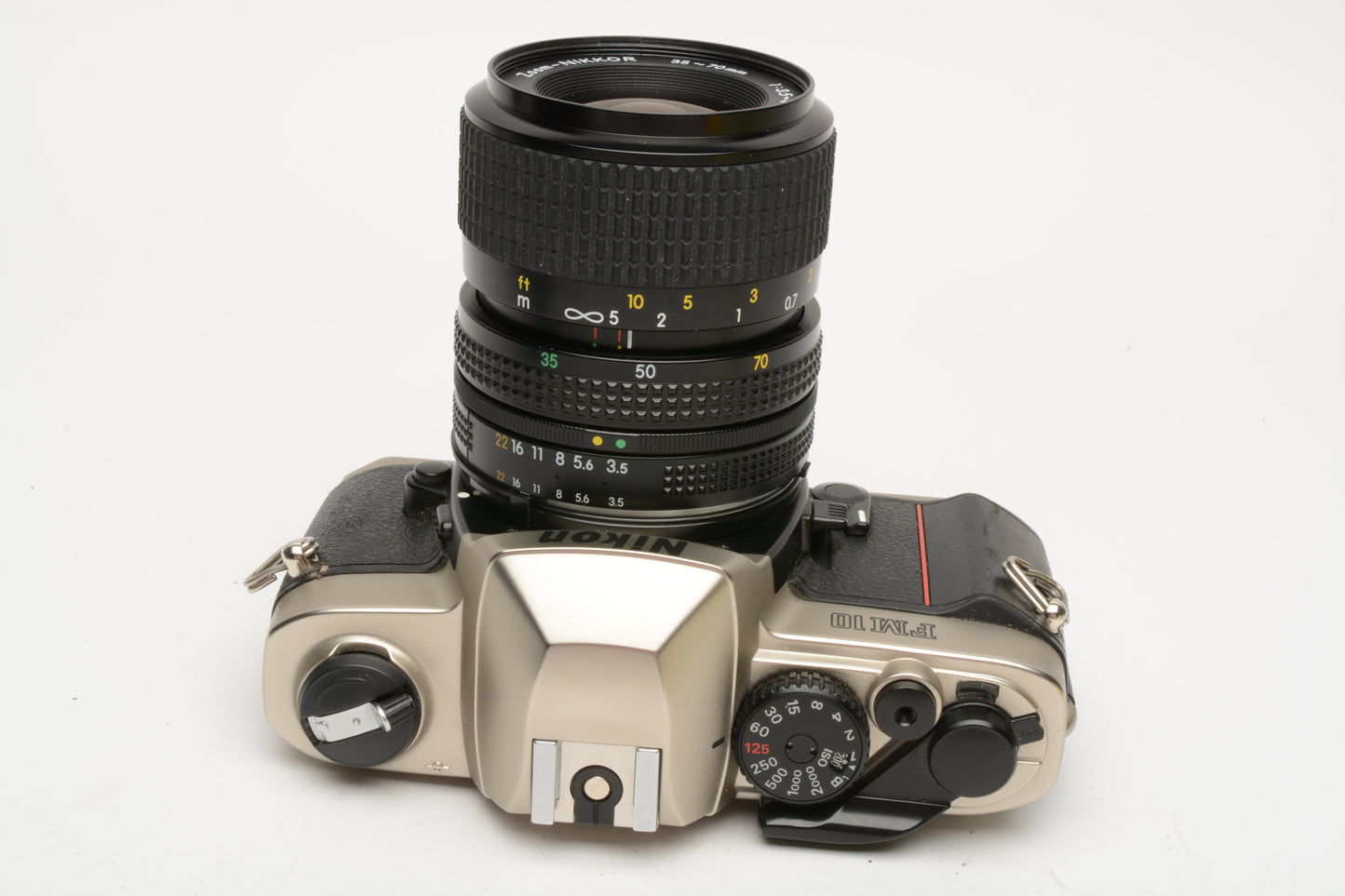 Nikon FM-10 35mm SLR w/35-70mm f3.5-4.8 zoom lens, cap+strap+pola, Great!