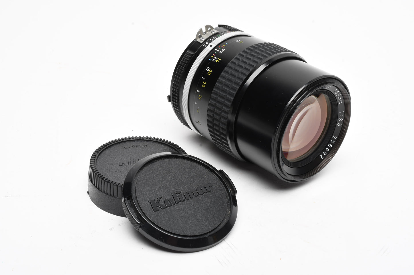Nikon Nikkor AI 135mm f2.8 lens, caps, very sharp