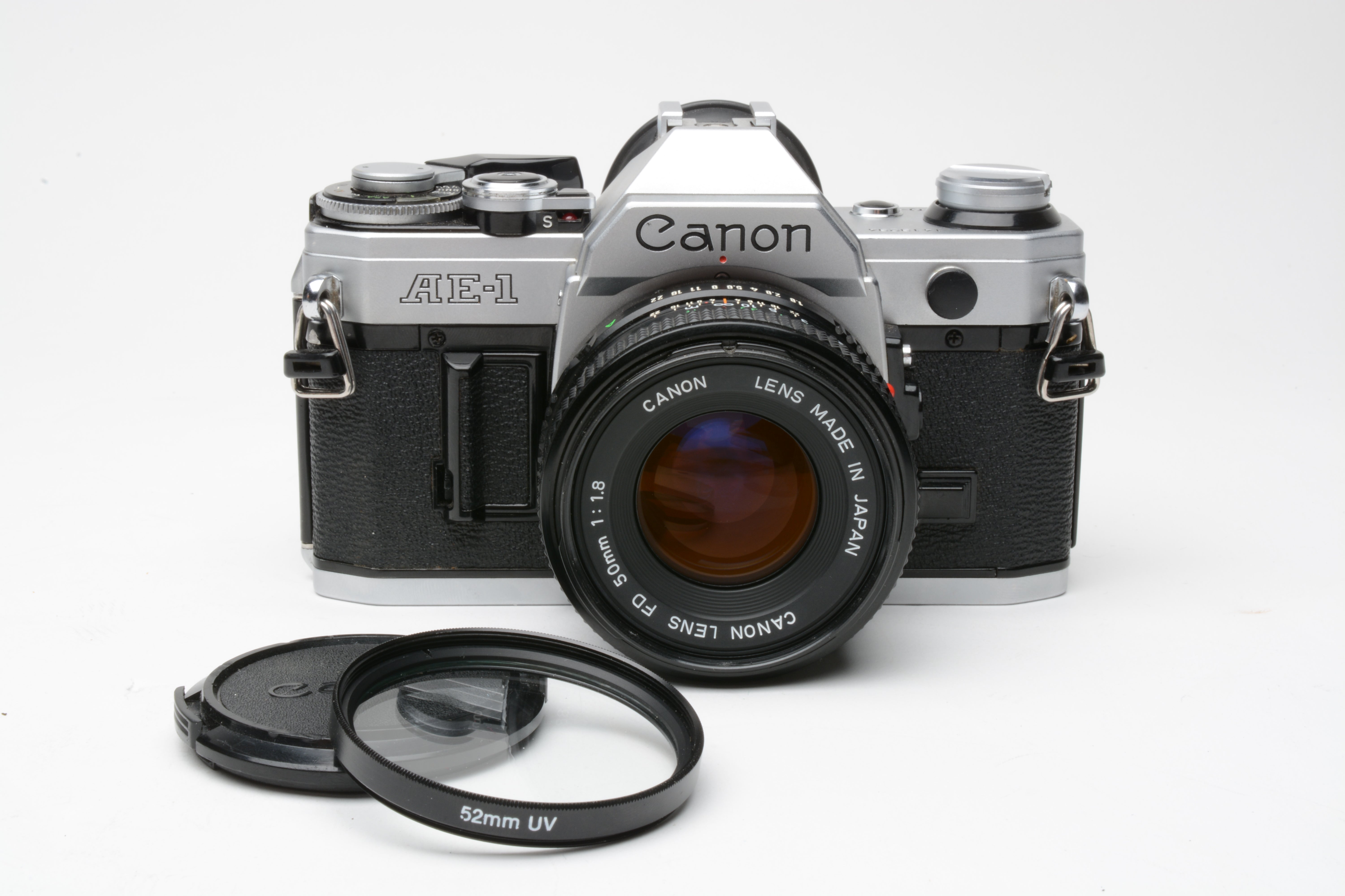 Canon AE-1 w/50mm f1.8 FD lens, new light seals, cap, UV, eyecup, test –  RecycledPhoto