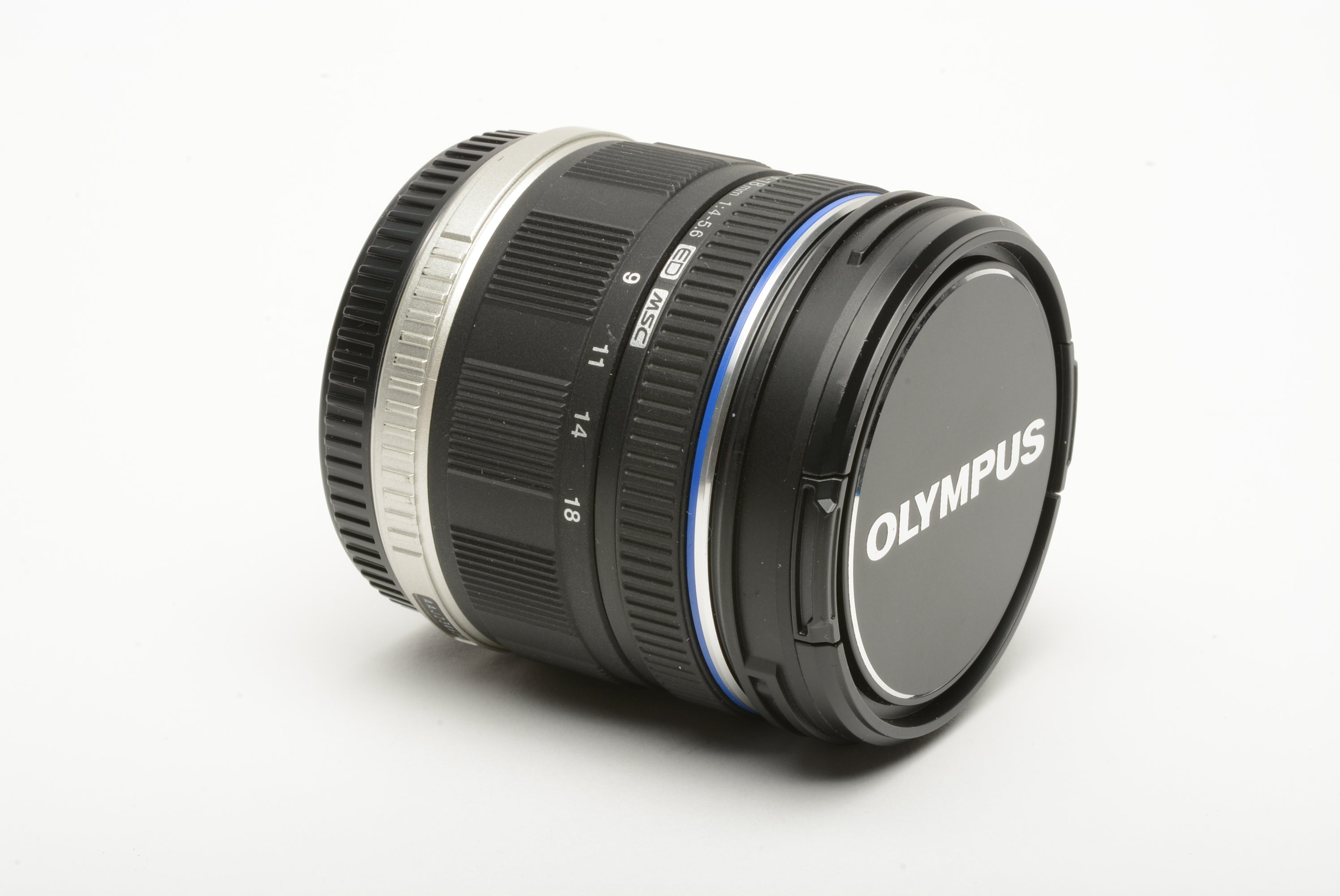 Olympus M. Zuiko ED 9-18mm f4-5.6 zoom lens w/caps, USA papers