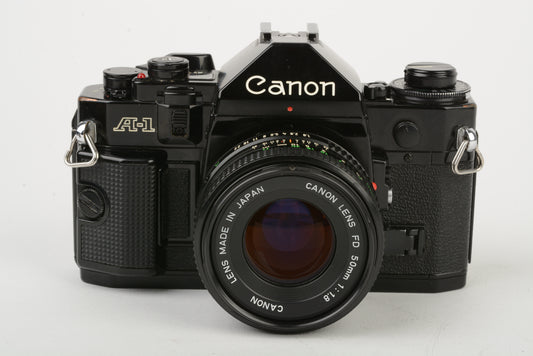 Canon A-1 35mm SLR w/50mm f1.8 lens, New Seals! strap, cap, very nice!!