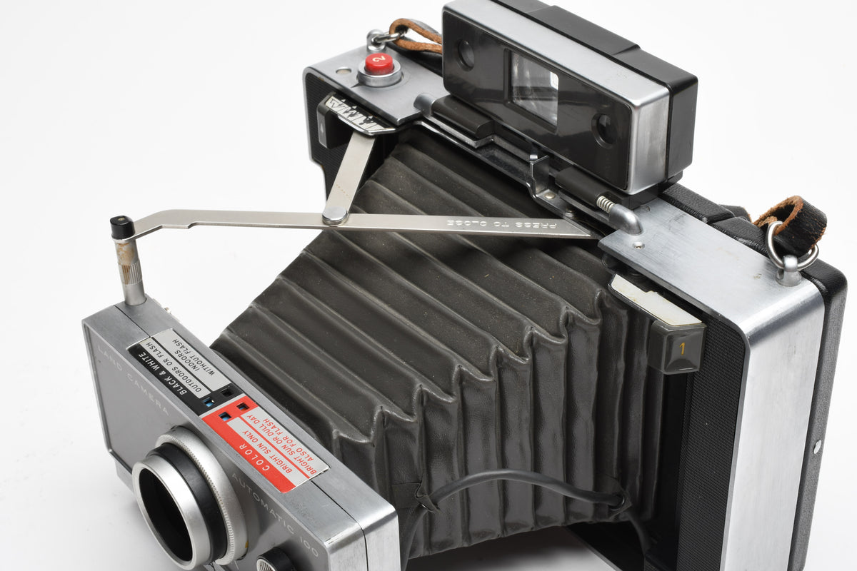 Polaroid Automatic 100 Instant camera w/strap