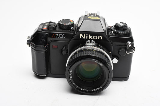Nikon N2000 35mm SLR W/Nikkor 50mm F1.8, strap, Sky, tested, Good!