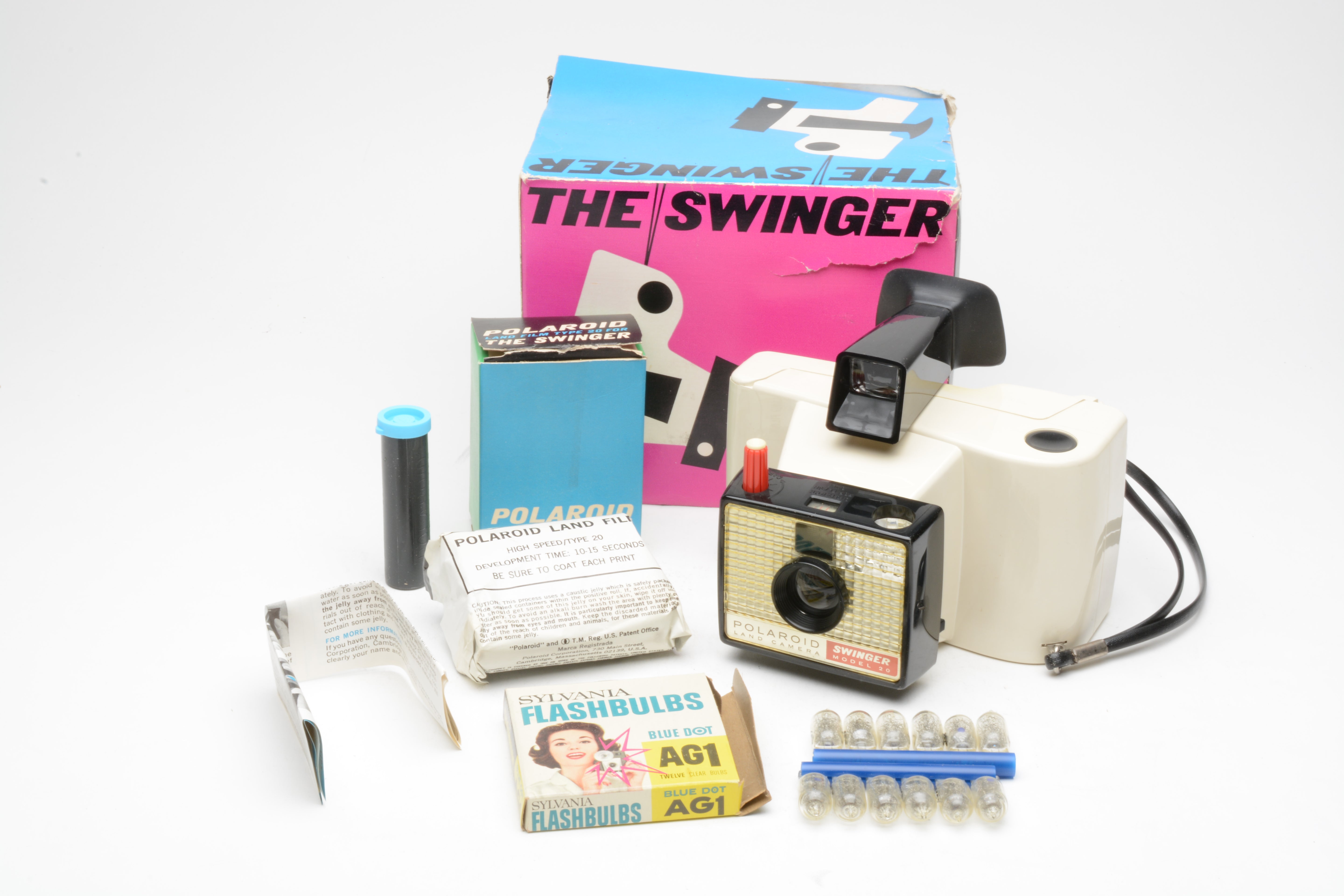 Polaroid The Swinger camera bundle, w/Film and AG1 flashbulbs