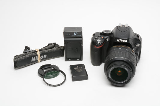 Nikon D5100 DSLR w/Nikkor 18-55mm F3.5-5.6G VR lens, 8354 Acts, batt+charger+strap