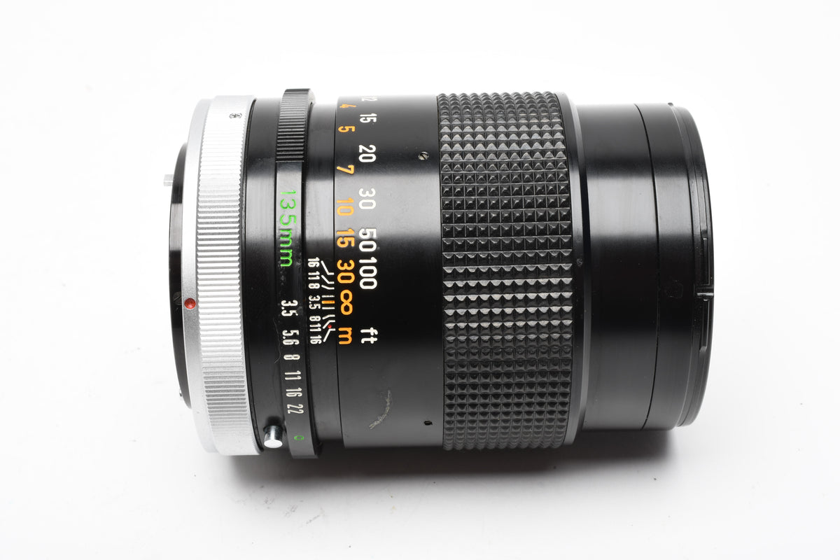 Canon 135mm F3.5 S.C. FD lens, caps, Sky, clean and sharp