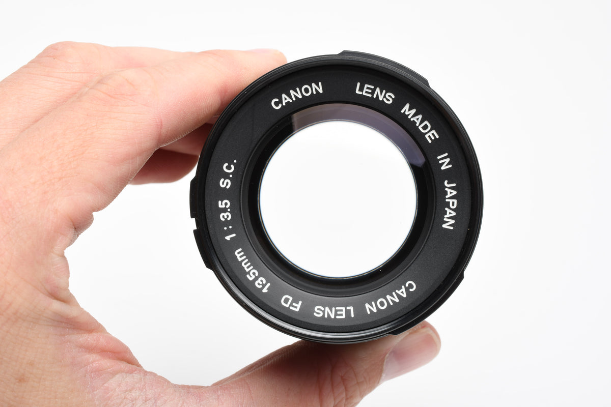 Canon 135mm F3.5 S.C. FD lens, caps, Sky, clean and sharp