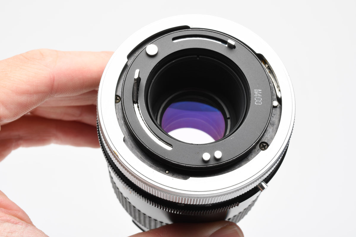 Canon 135mm F3.5 S.C. FD lens, caps, Sky, clean and sharp