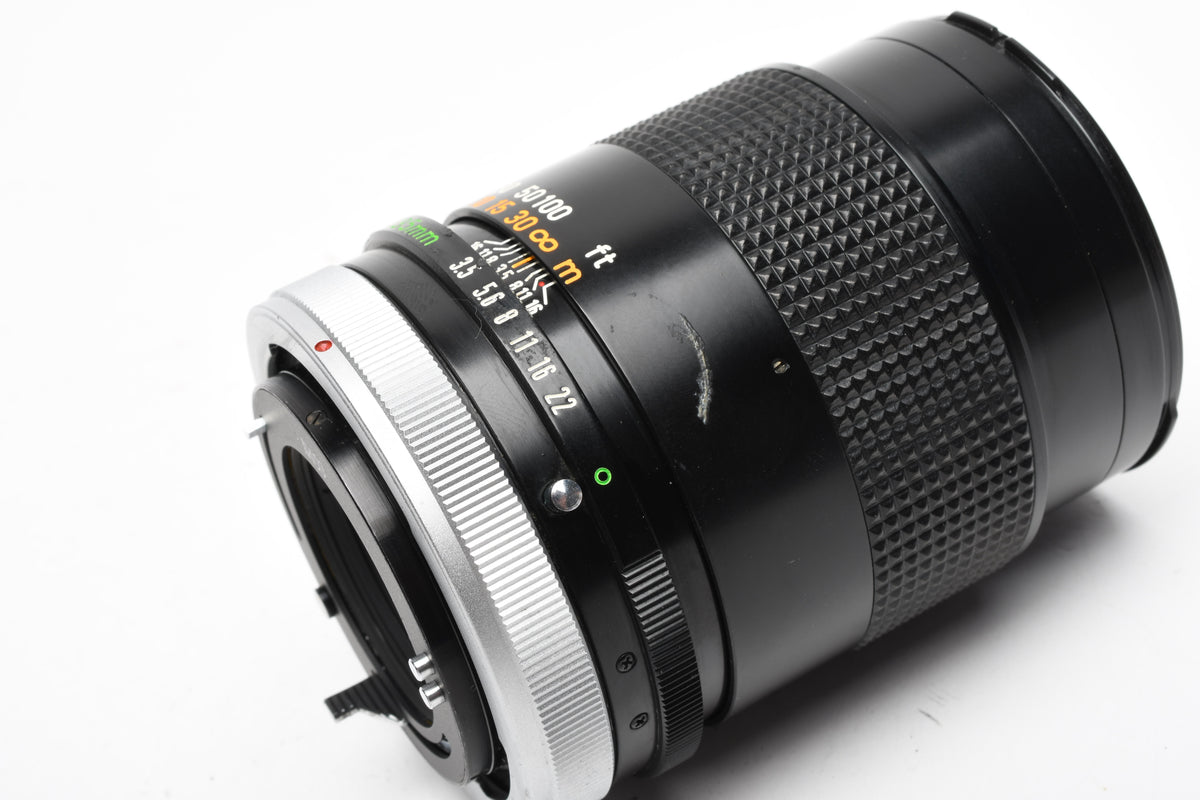 Canon 135mm F3.5 S.C. FD lens, caps, Sky, clean and sharp