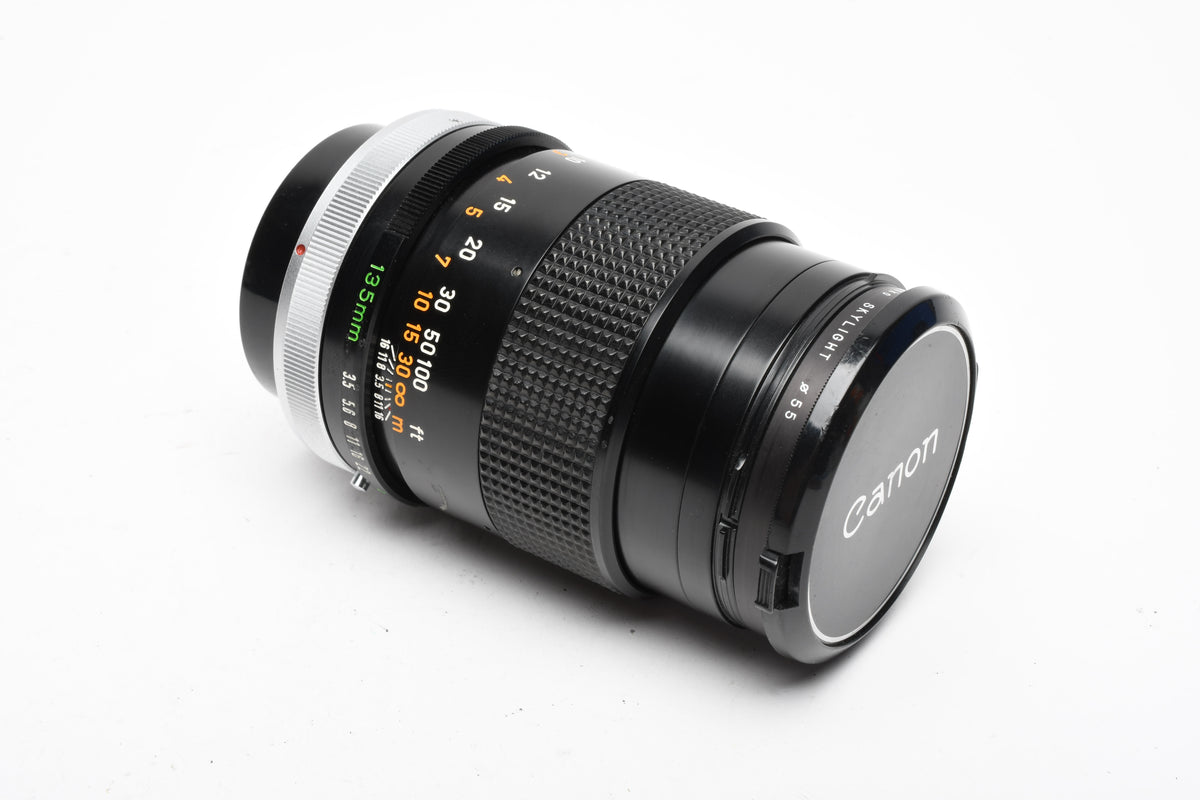 Canon 135mm F3.5 S.C. FD lens, caps, Sky, clean and sharp