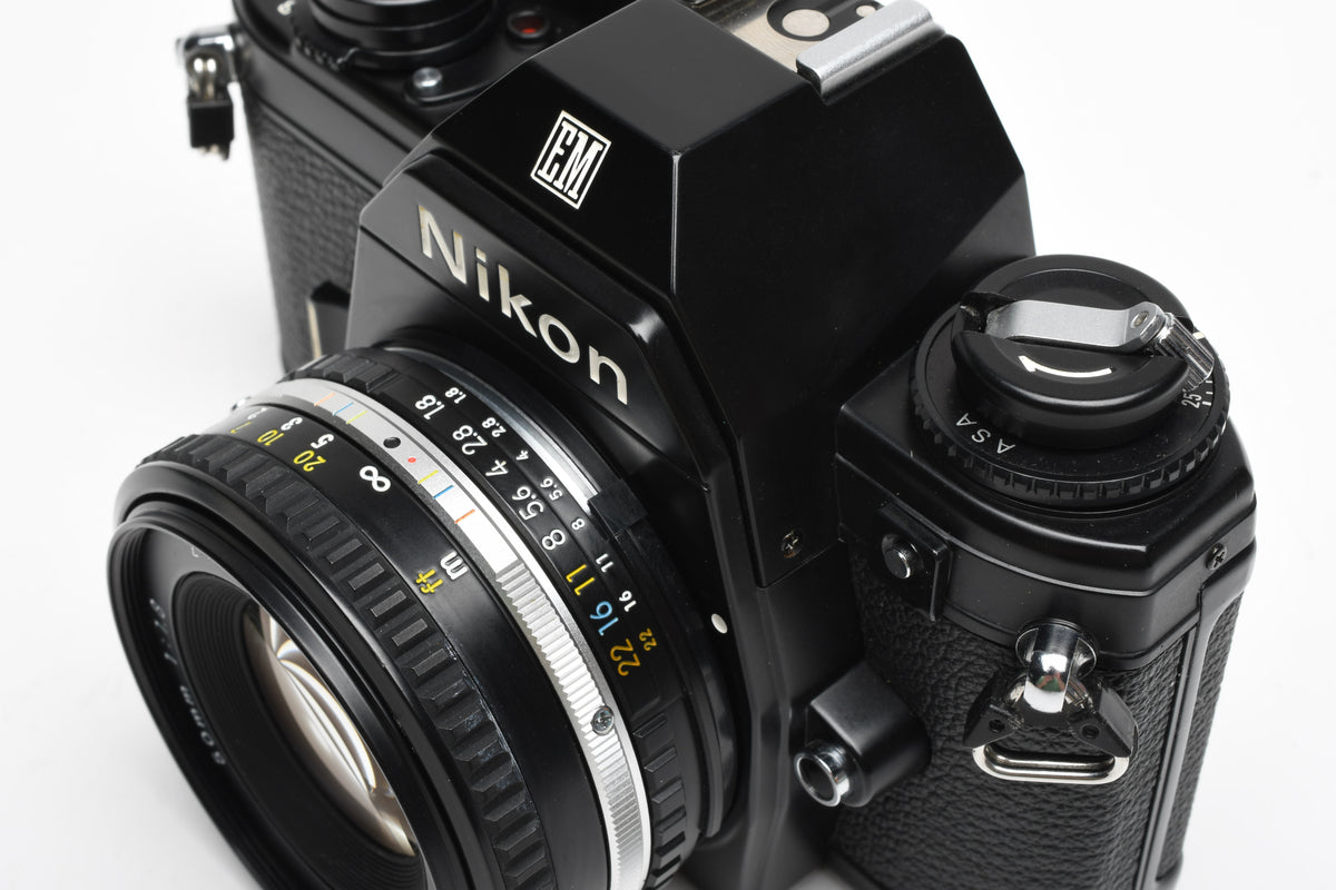 Nikon EM 35mm SLR w/Nikon Series E 50mm f1.8 Lens, Strap, New seals, Great!