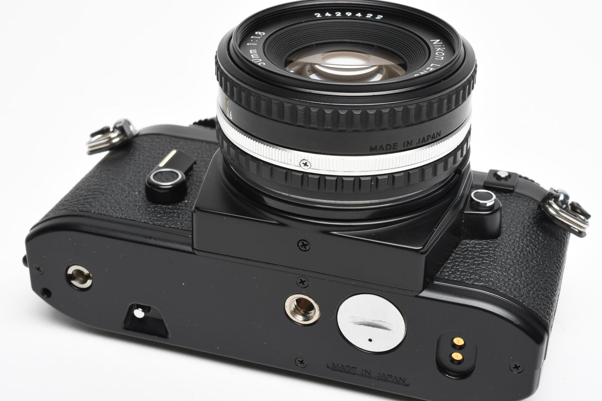 Nikon EM 35mm SLR w/Nikon Series E 50mm f1.8 Lens, Strap, New seals, Great!