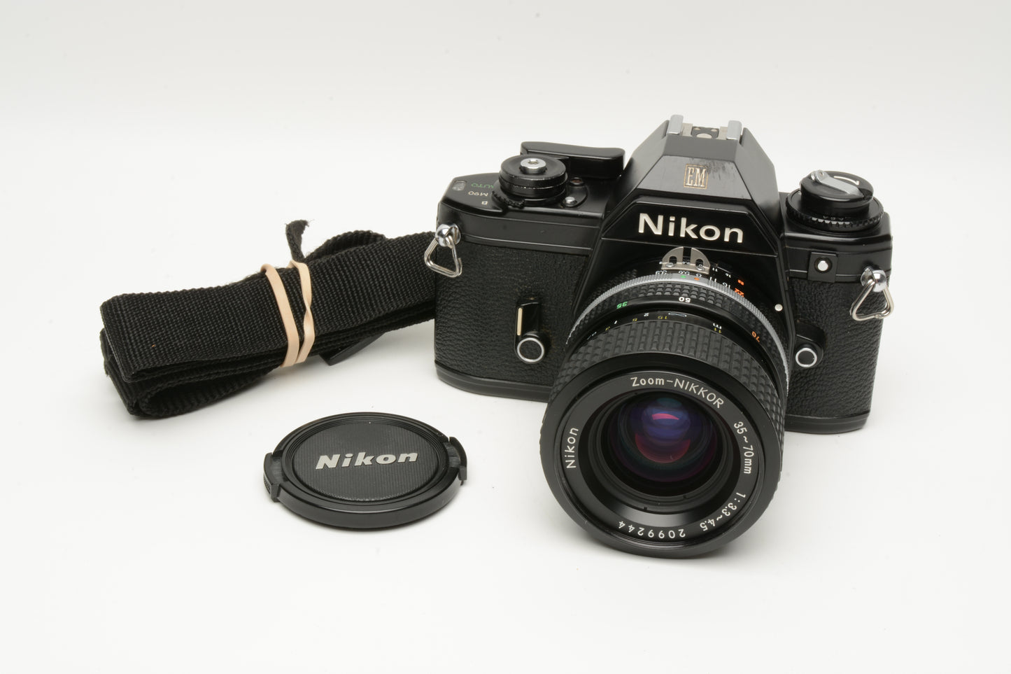 Nikon EM 35mm SLR w/Nikon Nikkor 35-70mm zoom, strap, Tested