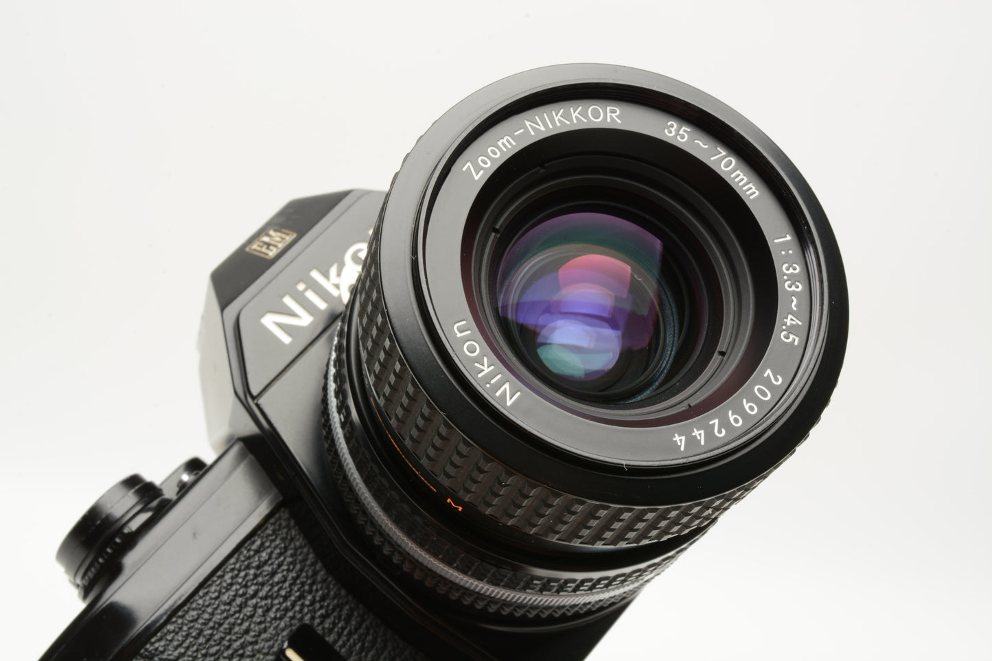 Nikon EM 35mm SLR w/Nikon Nikkor 35-70mm zoom, strap, Tested