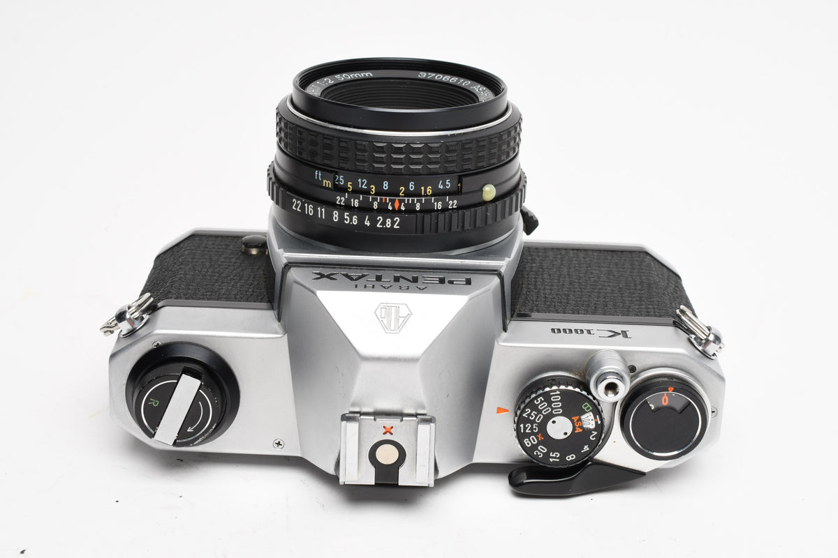 Pentax K1000 35mm SLR w/50mm f2 lens, New seals, strap