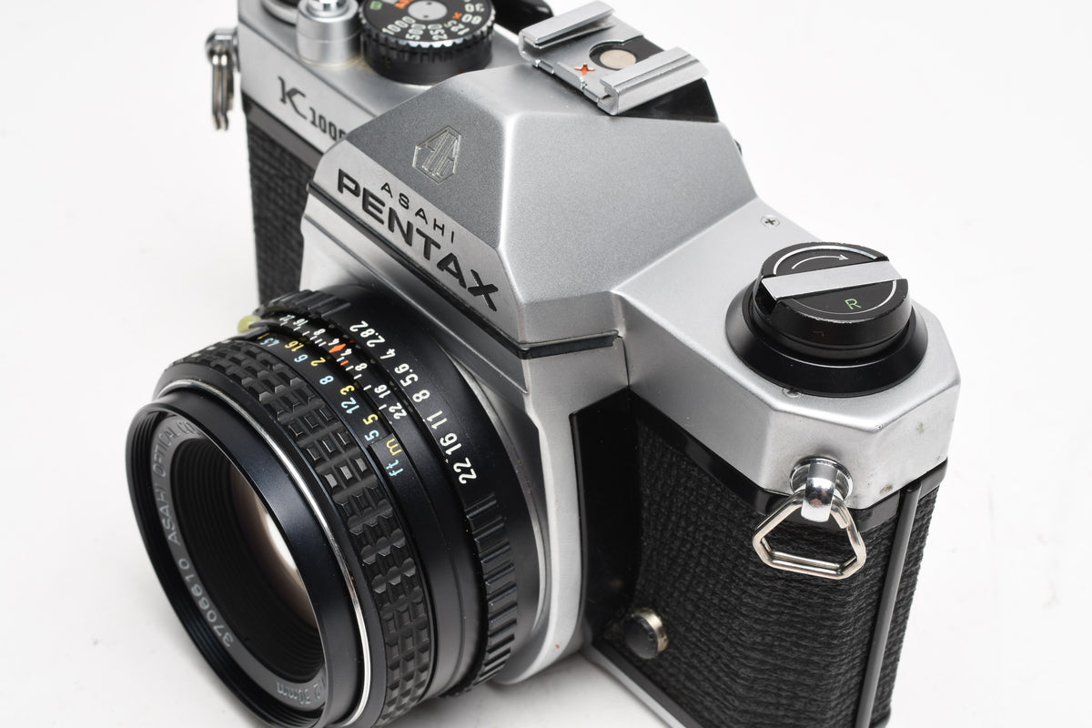 Pentax K1000 35mm SLR w/50mm f2 lens, New seals, strap