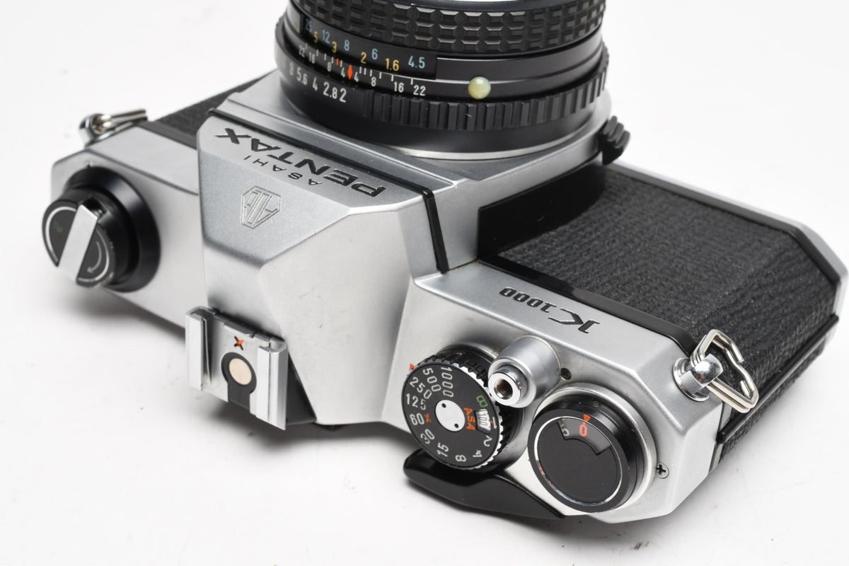 Pentax K1000 35mm SLR w/50mm f2 lens, New seals, strap
