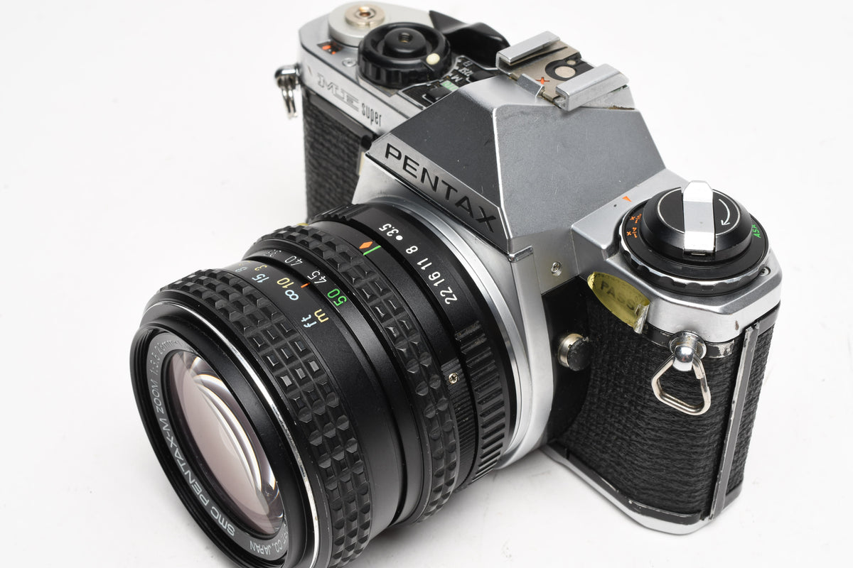 Pentax ME Super 35mm SLR w/28-50mm F3.5-4.5 Lens, Strap, Manual, New seals, Tested