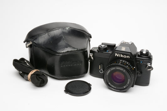 Nikon EM 35mm SLR w/Nikon Series E 50mm f1.8 lens, strap, cap, new seals + case