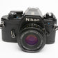 Nikon EM 35mm SLR w/Nikon Series E 50mm f1.8 lens, strap, cap, new seals + case