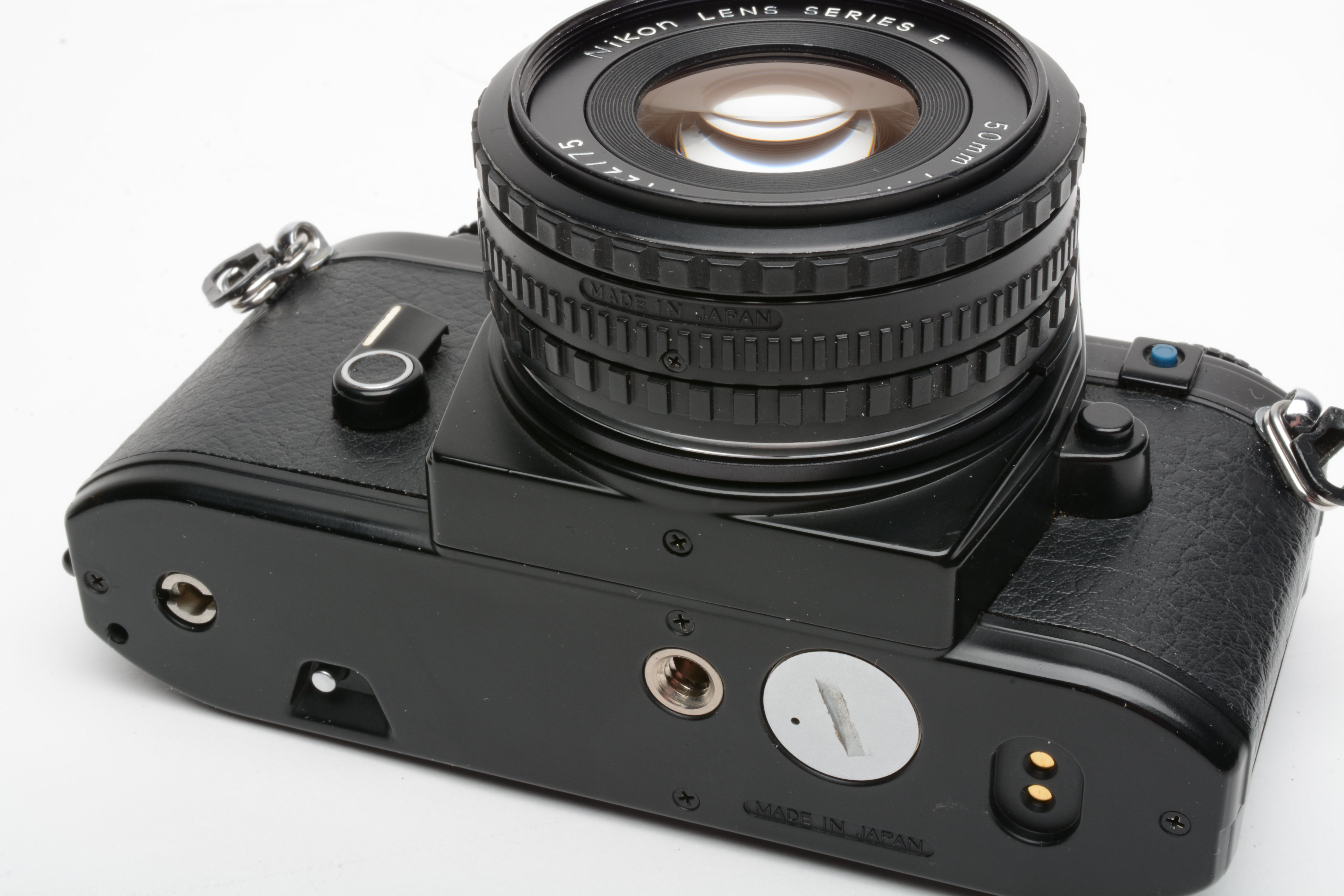 Nikon EM 35mm SLR w/Nikon Series E 50mm f1.8 lens, strap, cap, new seals +  case