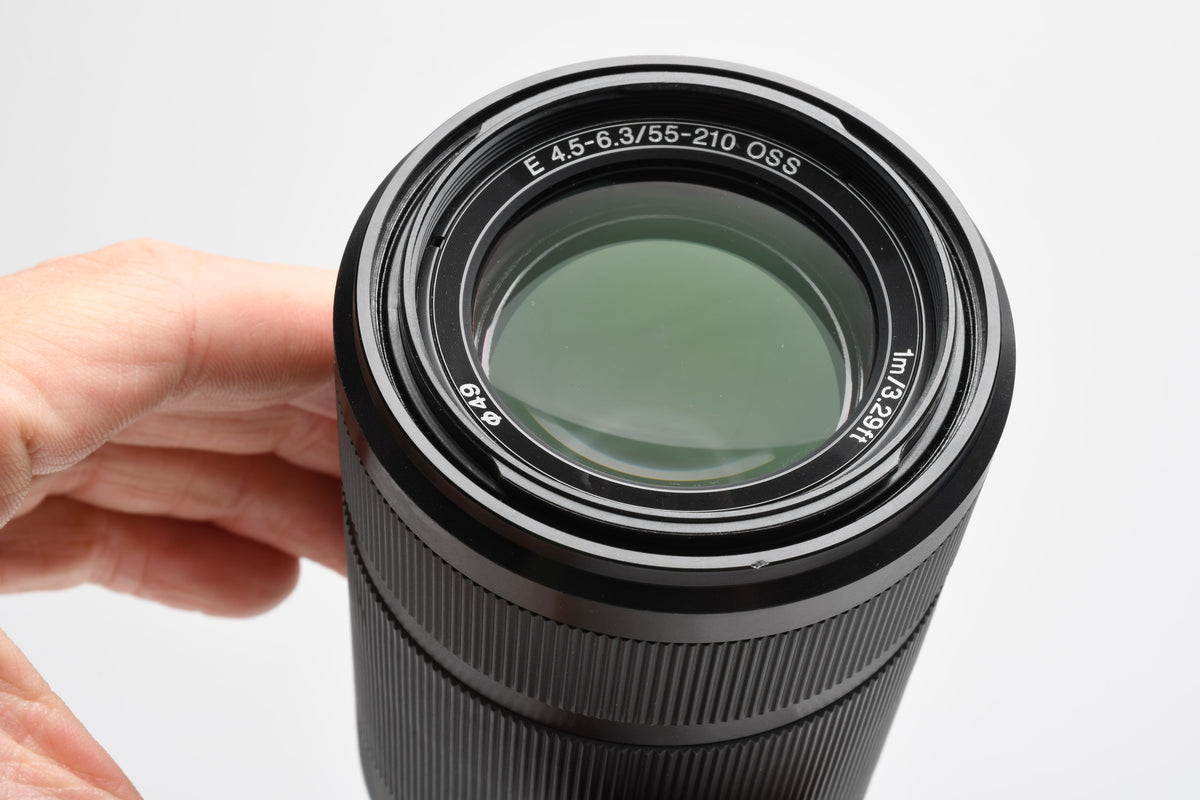 Sony 55-210mm f4.5-6.3 OSS zoom lens (Black) w/Lens caps, Lens hood