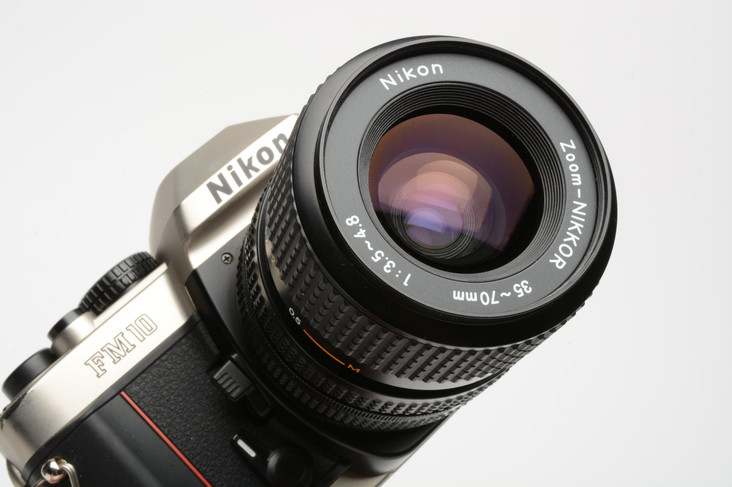 Nikon FM-10 35mm SLR w/35-70mm f3.5-4.8 zoom lens, cap+strap+case, Clean!