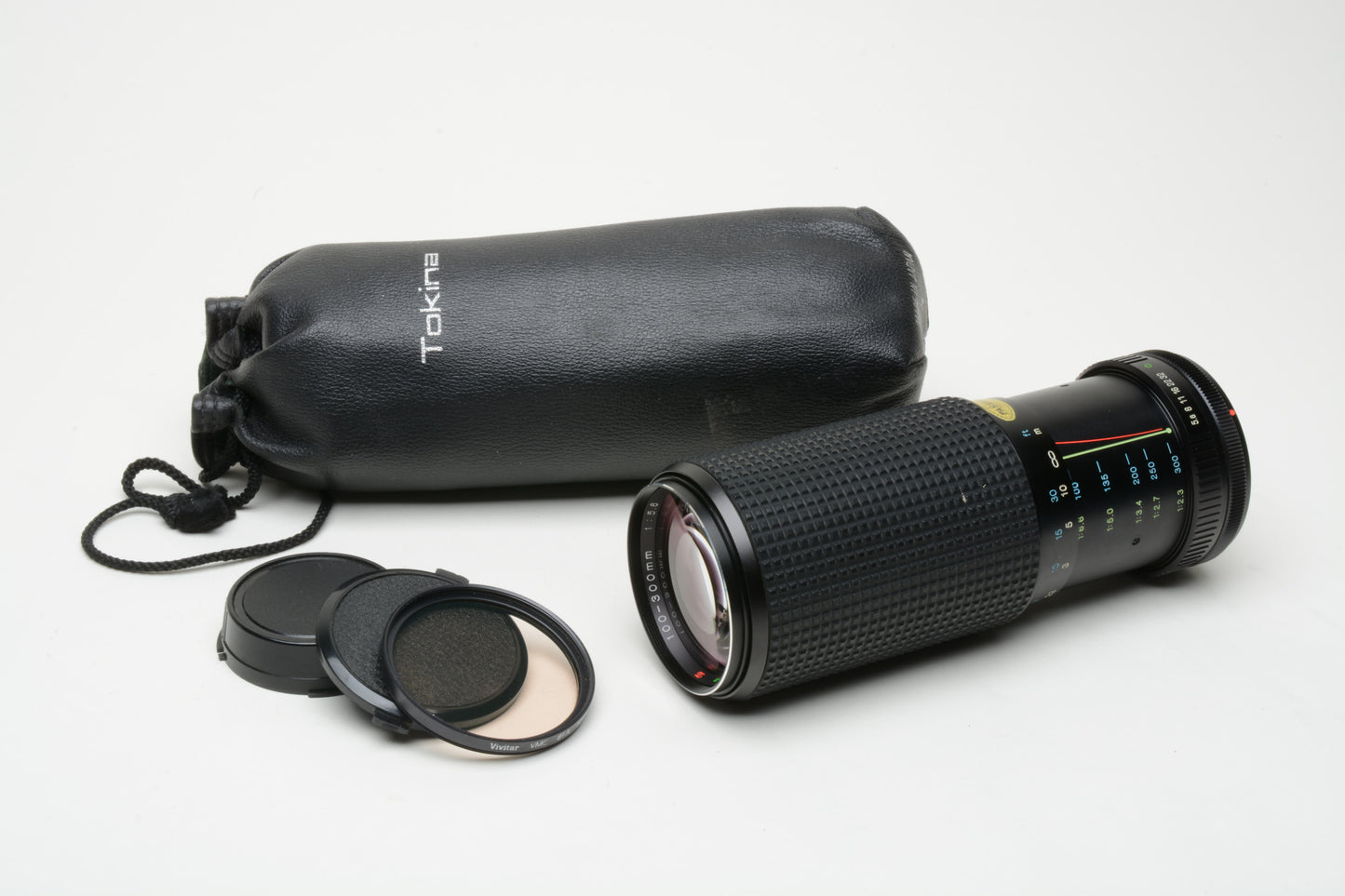 Tokina RMC 100-300mm f5.6 Telephoto zoom lens, caps, pouch, for Canon FD Mount