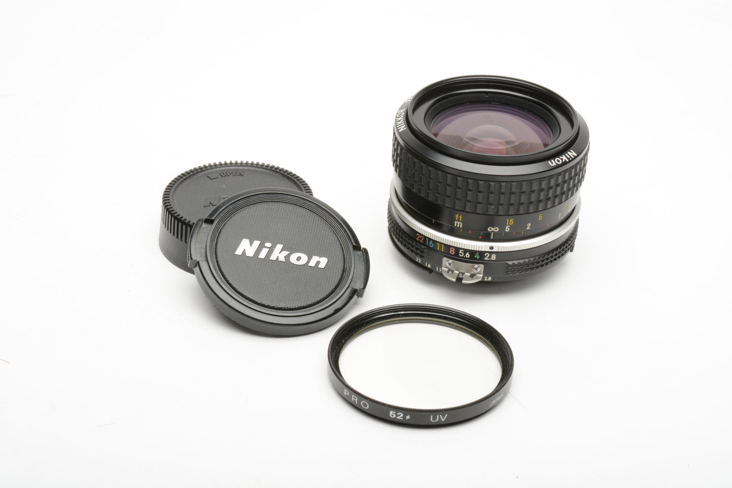 Nikon Nikkor 28mm AI mount lens, caps, nice & clean _+ UV filter