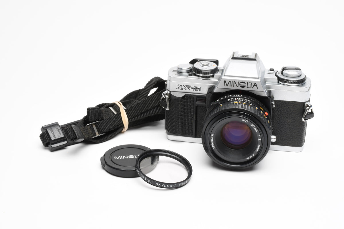 Minolta XG-M 35mm SLR w/50mm f2 lens, strap, new seals, cap, UV, Nice