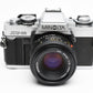 Minolta XG-M 35mm SLR w/50mm f2 lens, strap, new seals, cap, UV, Nice