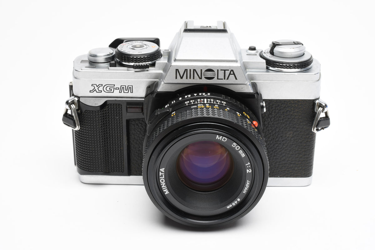 Minolta XG-M 35mm SLR w/50mm f2 lens, strap, new seals, cap, UV, Nice
