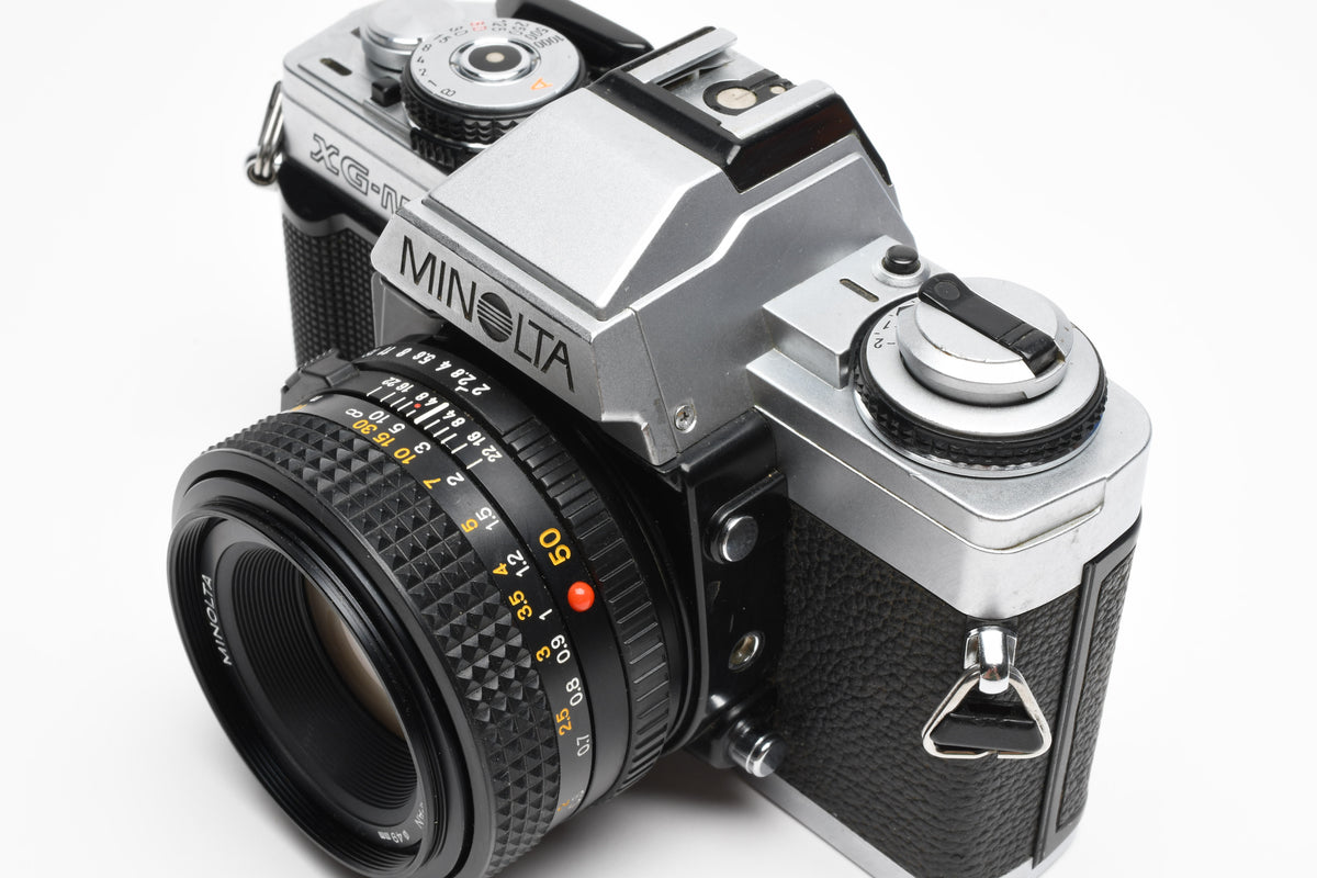 Minolta XG-M 35mm SLR w/50mm f2 lens, strap, new seals, cap, UV, Nice