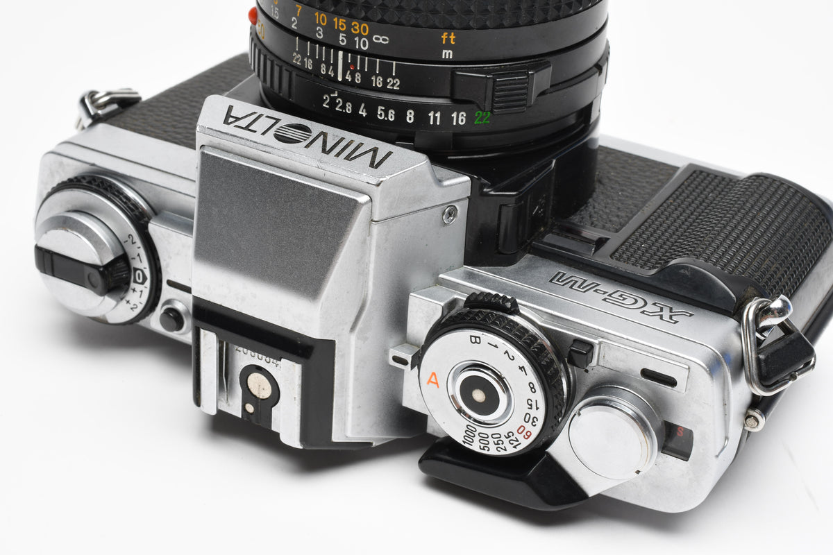 Minolta XG-M 35mm SLR w/50mm f2 lens, strap, new seals, cap, UV, Nice