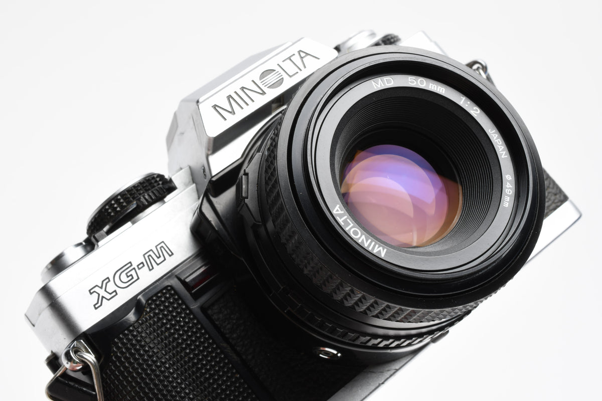 Minolta XG-M 35mm SLR w/50mm f2 lens, strap, new seals, cap, UV, Nice