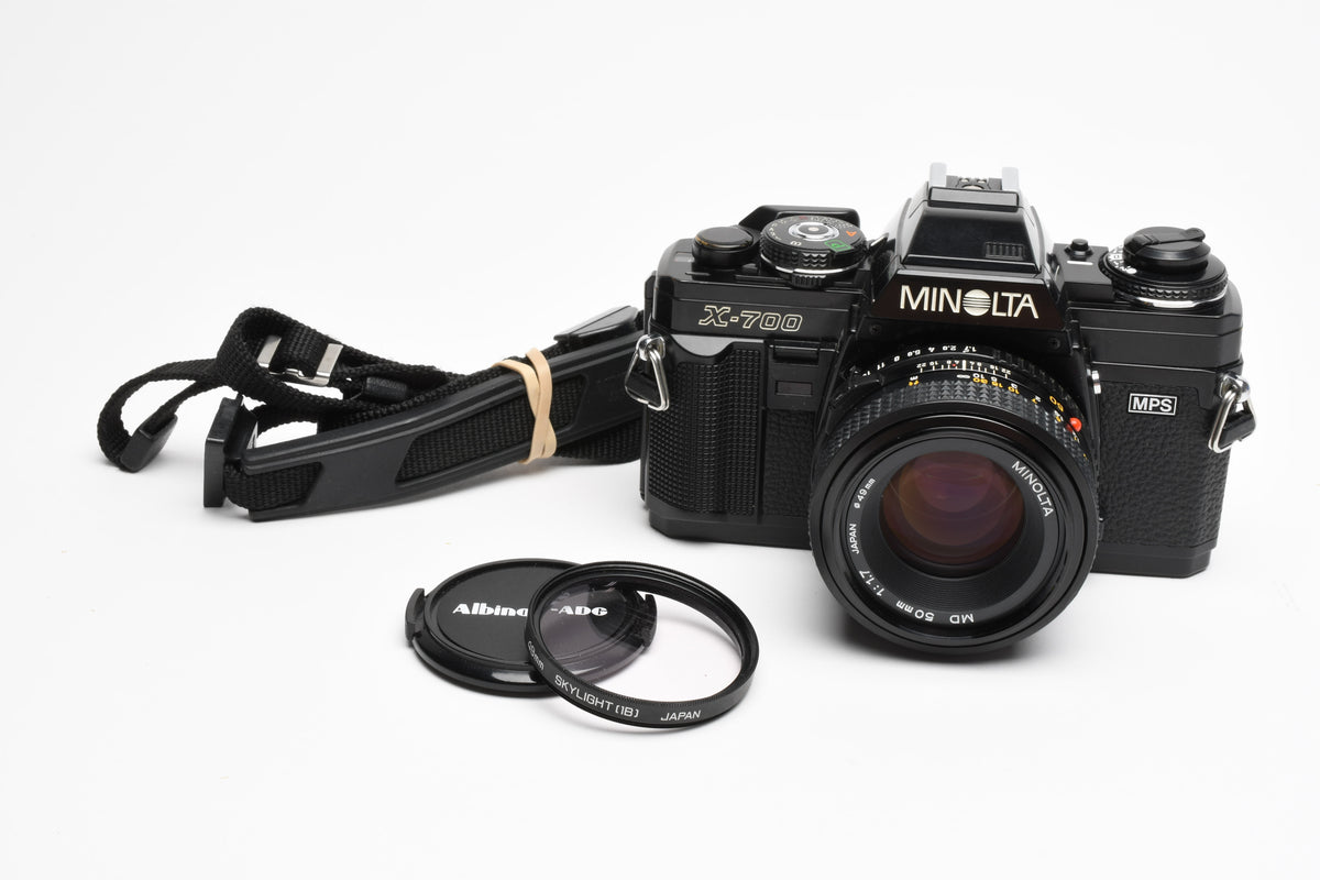 Minolta X700 35mm SLR w/50mm f1.7 lens, strap, cap, Sky, new seals, Nice!