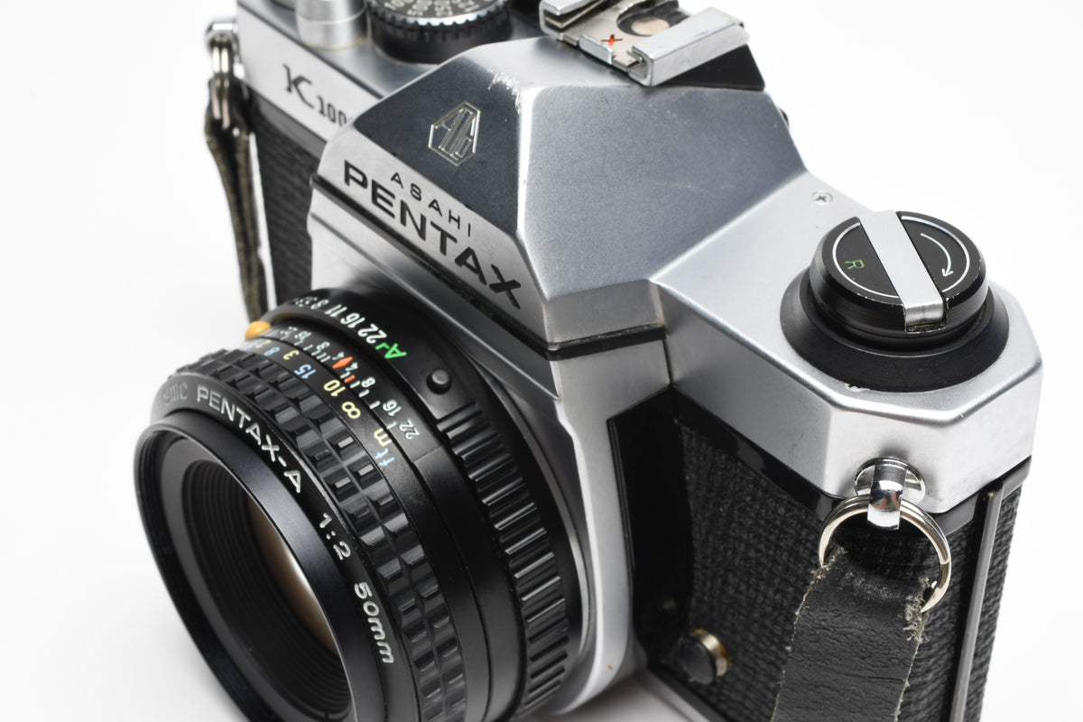 Pentax K1000 35mm SLR w/50mm f2 lens, New seals, strap, Great!