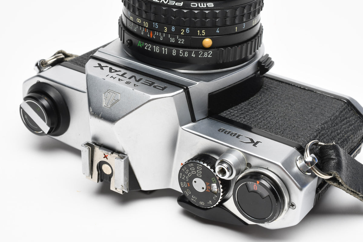 Pentax K1000 35mm SLR w/50mm f2 lens, New seals, strap, Great!