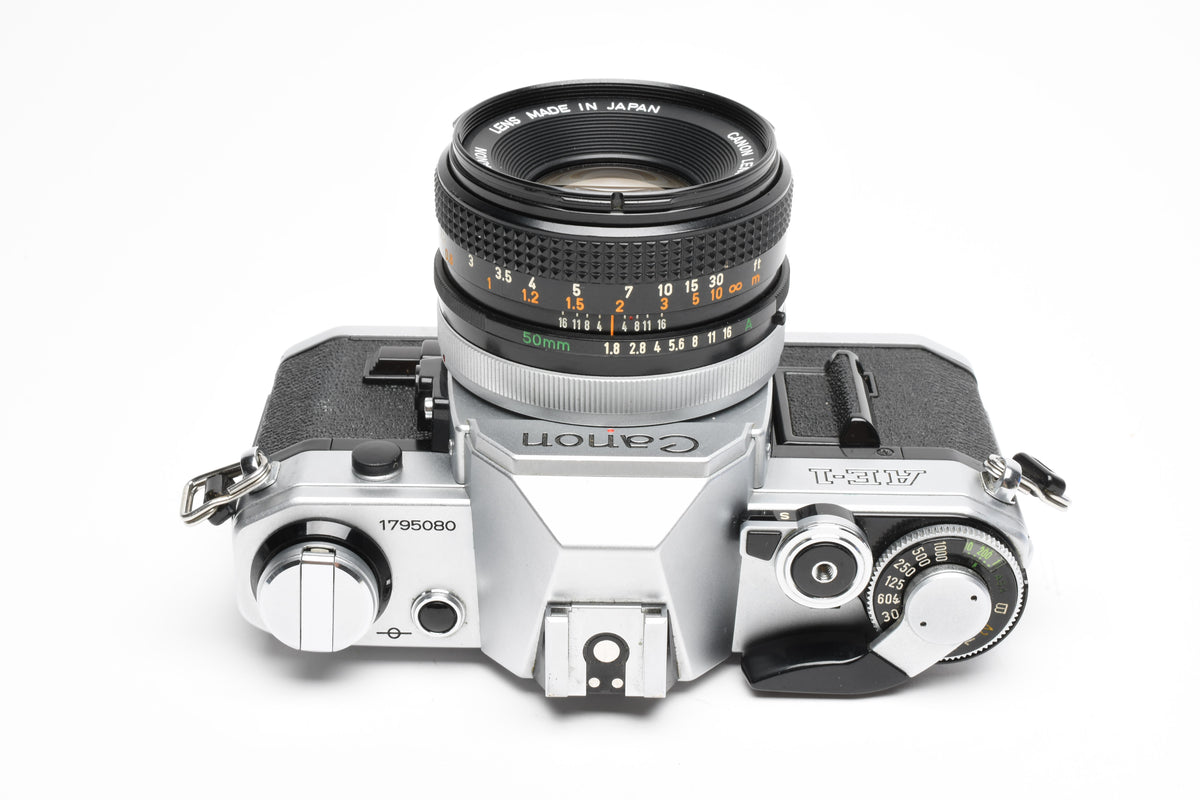 Canon AE-1 35mm SLR Camera w/50mm f1.8 Lens, UV, New Seals! Great!