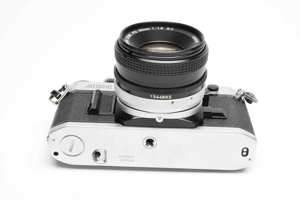 Canon AE-1 35mm SLR Camera w/50mm f1.8 Lens, UV, New Seals! Great!