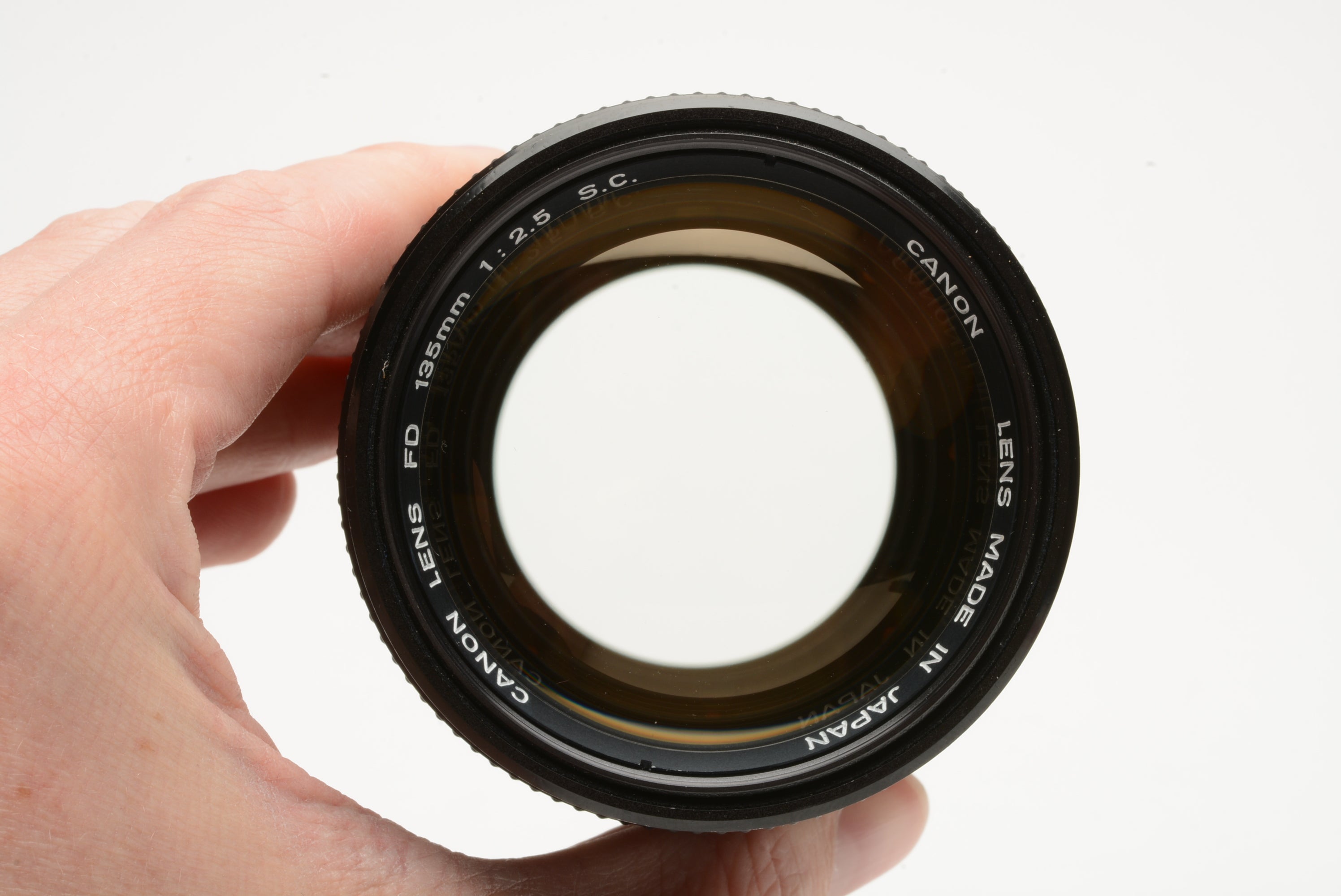 Canon 135mm f2.5 S.C. portrait lens, sky filter, caps, case, Very 