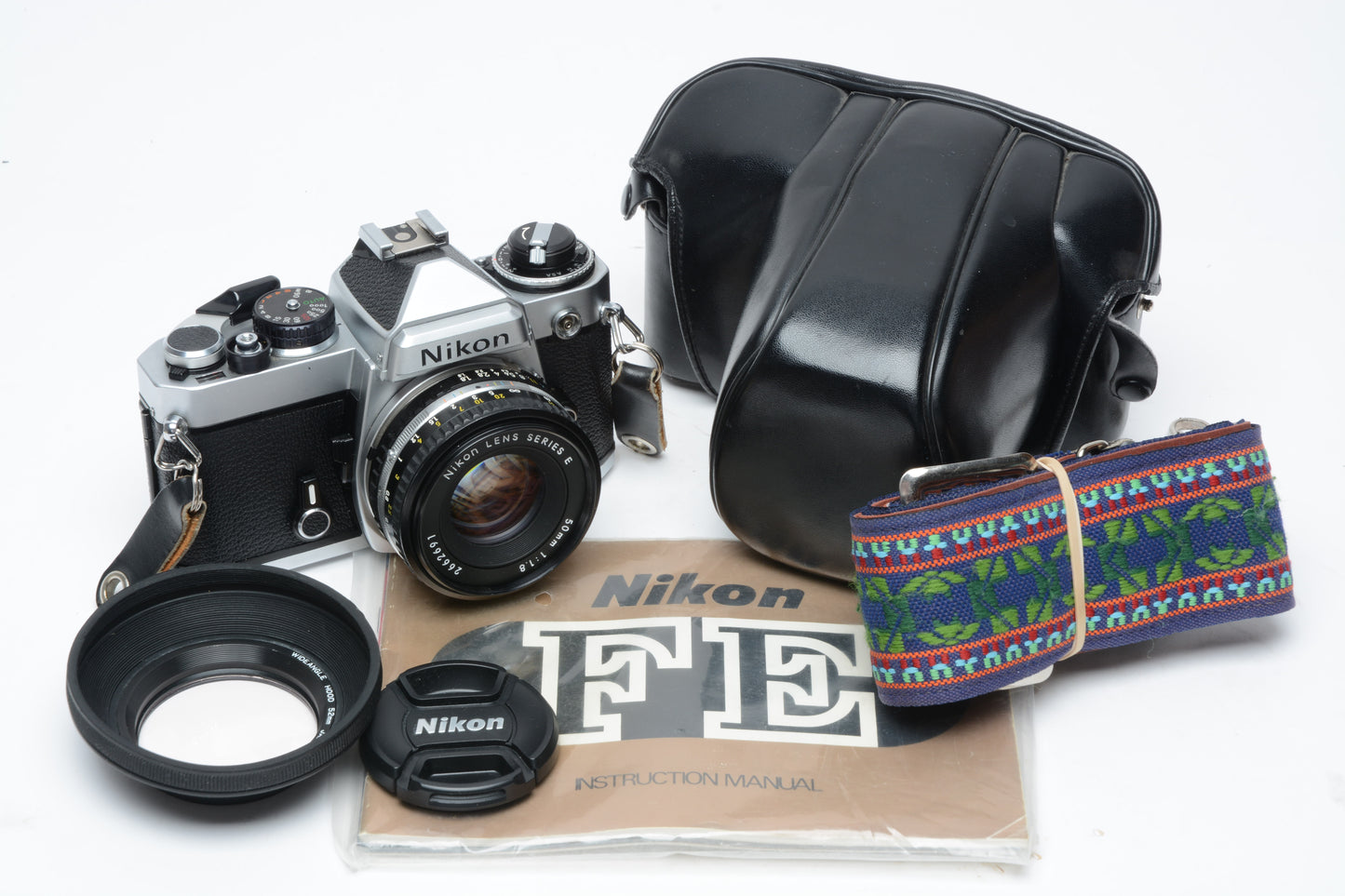 Nikon FE 35mm SLR w/50mm f1.8 E , Strap, New Seals, Case, Tested!