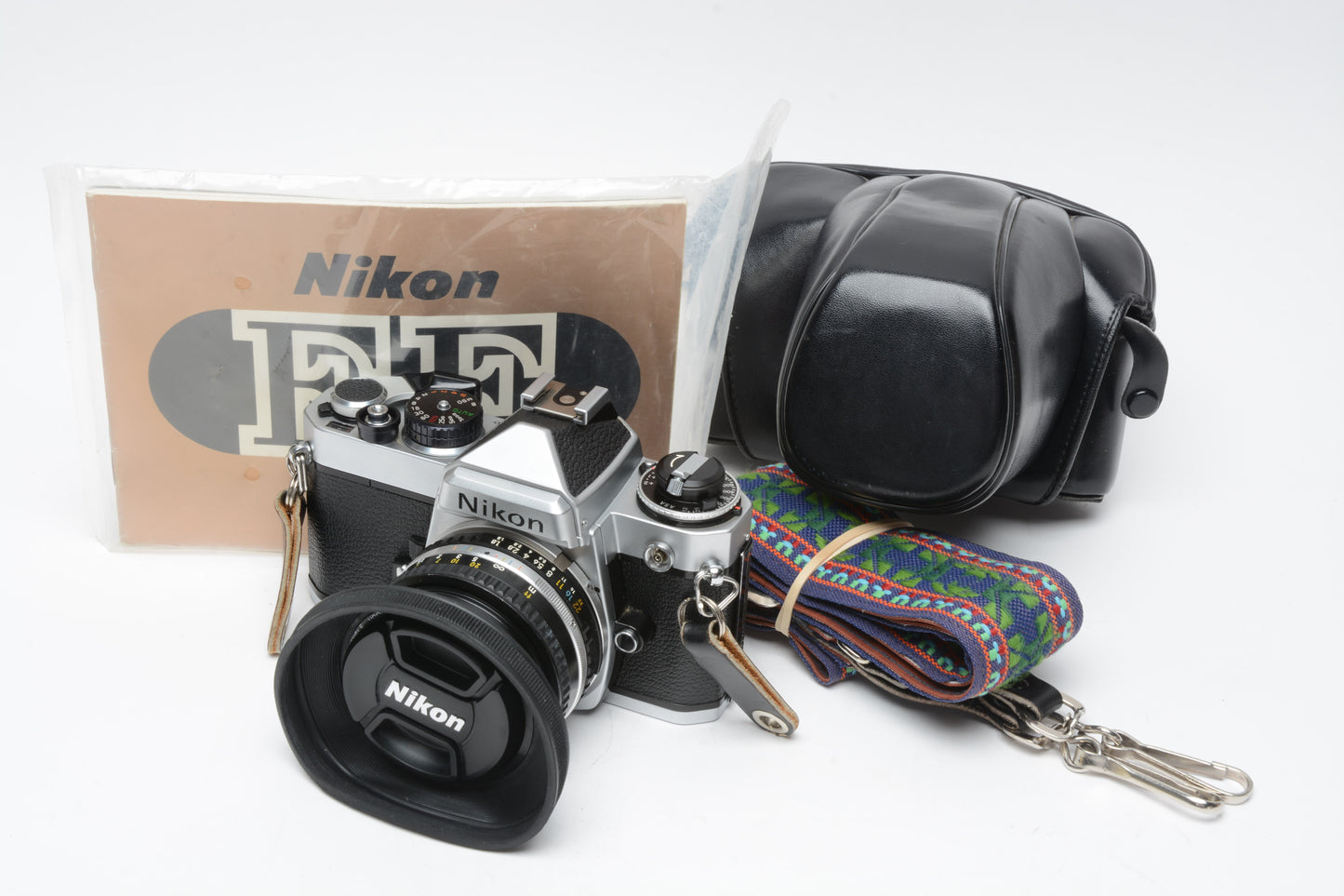 Nikon FE 35mm SLR w/50mm f1.8 E , Strap, New Seals, Case, Tested!