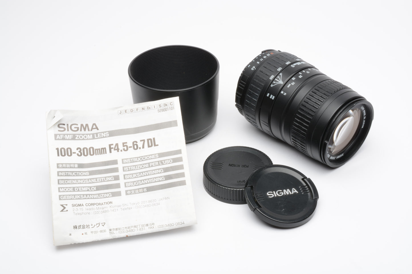 Sigma AF 100-300mm f4.5-6.7 DL Telephoto zoom lens for Nikon AF, +caps & hood