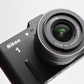 Nikon 1 V1 Mirrorless Camera w/Nikkor 10-30mm lens, UV, batt+charger, Mint-